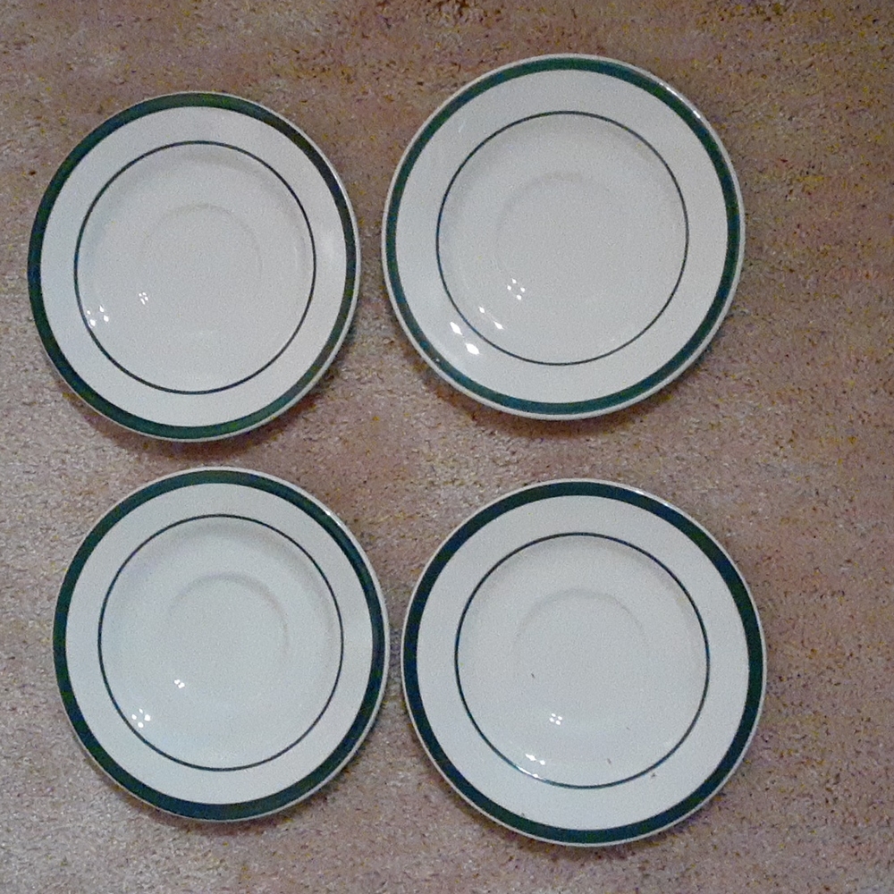 4 small plates, green and white, like new. No damage